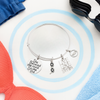 Silver-plated swim bangle bracelet gift for swimmers and coaches with 'Love Swim' charm
