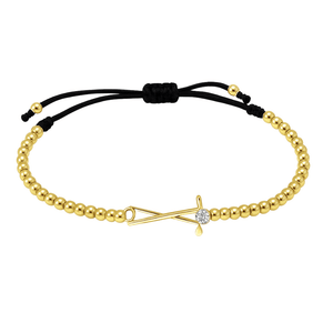 Gold beaded golf bracelet with rhinestone golf club charm and black adjustable cord
