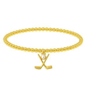 Women’s beaded gold bracelet featuring a small charm of crossed golf clubs