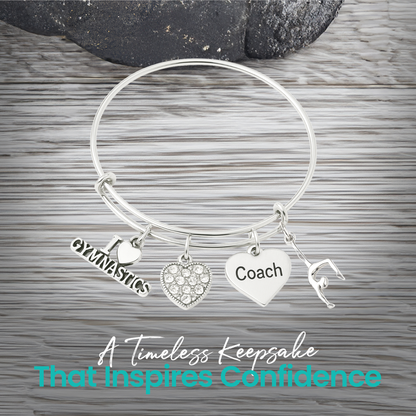Silver gymnastics coach charm bracelet with heart pendant and gymnast charm