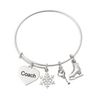 Silver plated figure skating coach bangle bracelet with heart, snowflake, and skater charms