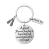 Close-up of Irish dance keychain with “A great Dance Teacher is hard to find” engraved message