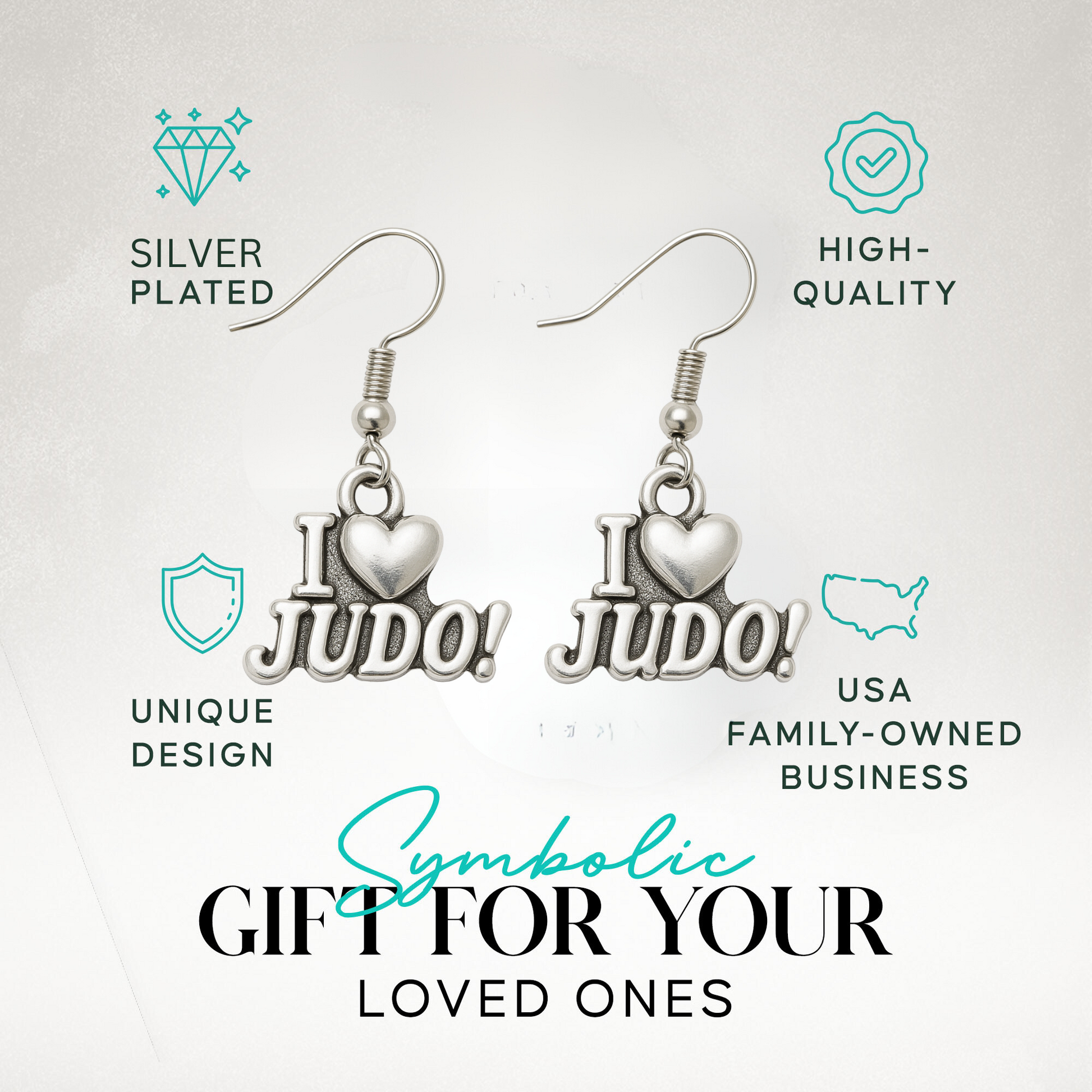 “I Love Judo” earrings displayed in branded packaging with icons for durability and hypoallergenic features