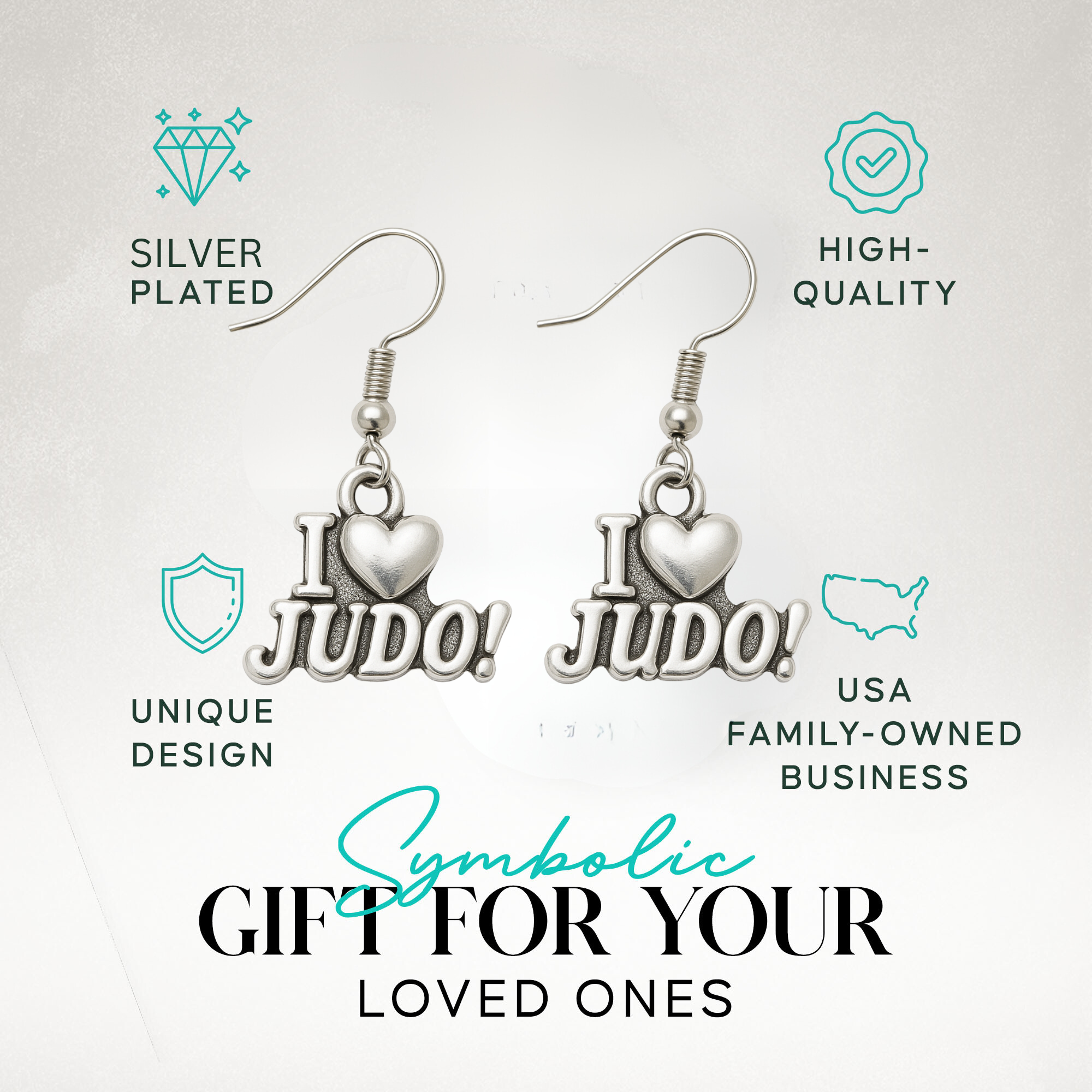 “I Love Judo” earrings displayed in branded packaging with icons for durability and hypoallergenic features