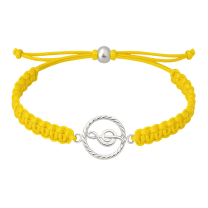 Vibrant yellow music rope bracelet with treble clef charm, adjustable slip knot fit.