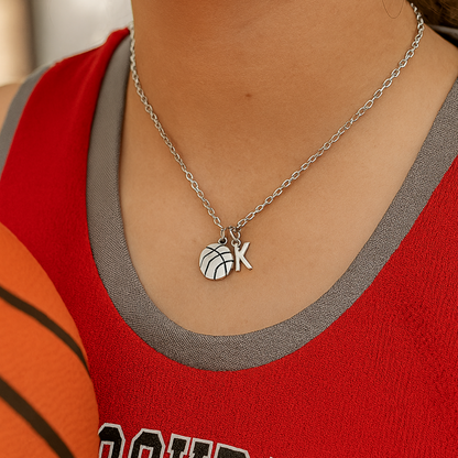 Teen girl wearing personalized basketball necklace with initial charm on jersey