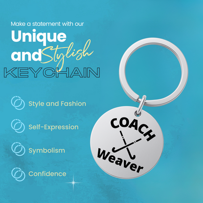 Engraved stainless steel coach keychain shown on turquoise background with product features