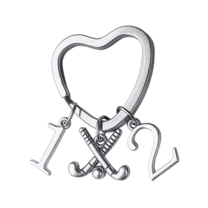 Silver plated heart-shaped field hockey keychain with crossed sticks charm and number charms
