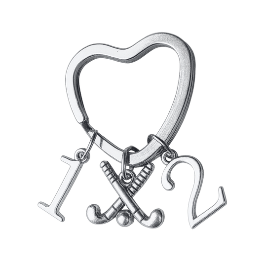 Silver plated heart-shaped field hockey keychain with crossed sticks charm and number charms