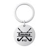 Stainless steel field hockey stick keychain engraved with name on white background