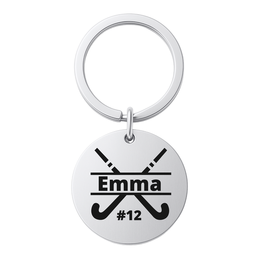 Stainless steel field hockey stick keychain engraved with name on white background