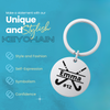 Custom name field hockey stick keychain shown on blue background