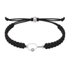 Black rope bracelet featuring silver pickleball paddle charm, laid flat