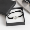 Ice skate bracelet in black displayed in a gift box, perfect for skaters
