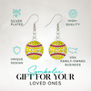 Sparkly softball earrings with crystal detail and stitching design, displayed on branded card for gift-giving