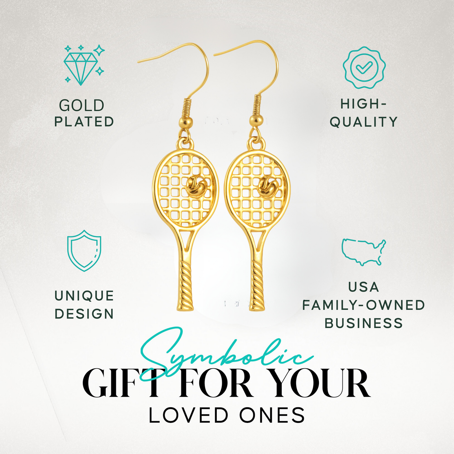Gold tennis racket dangle earrings displayed with gift packaging