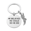 Silver track and field keychain with 'He Believed He Could So He Did' charm and running shoe pendant