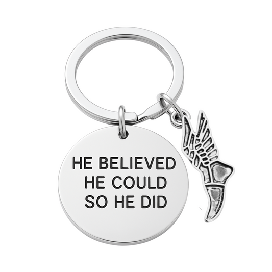 Silver track and field keychain with 'He Believed He Could So He Did' charm and running shoe pendant