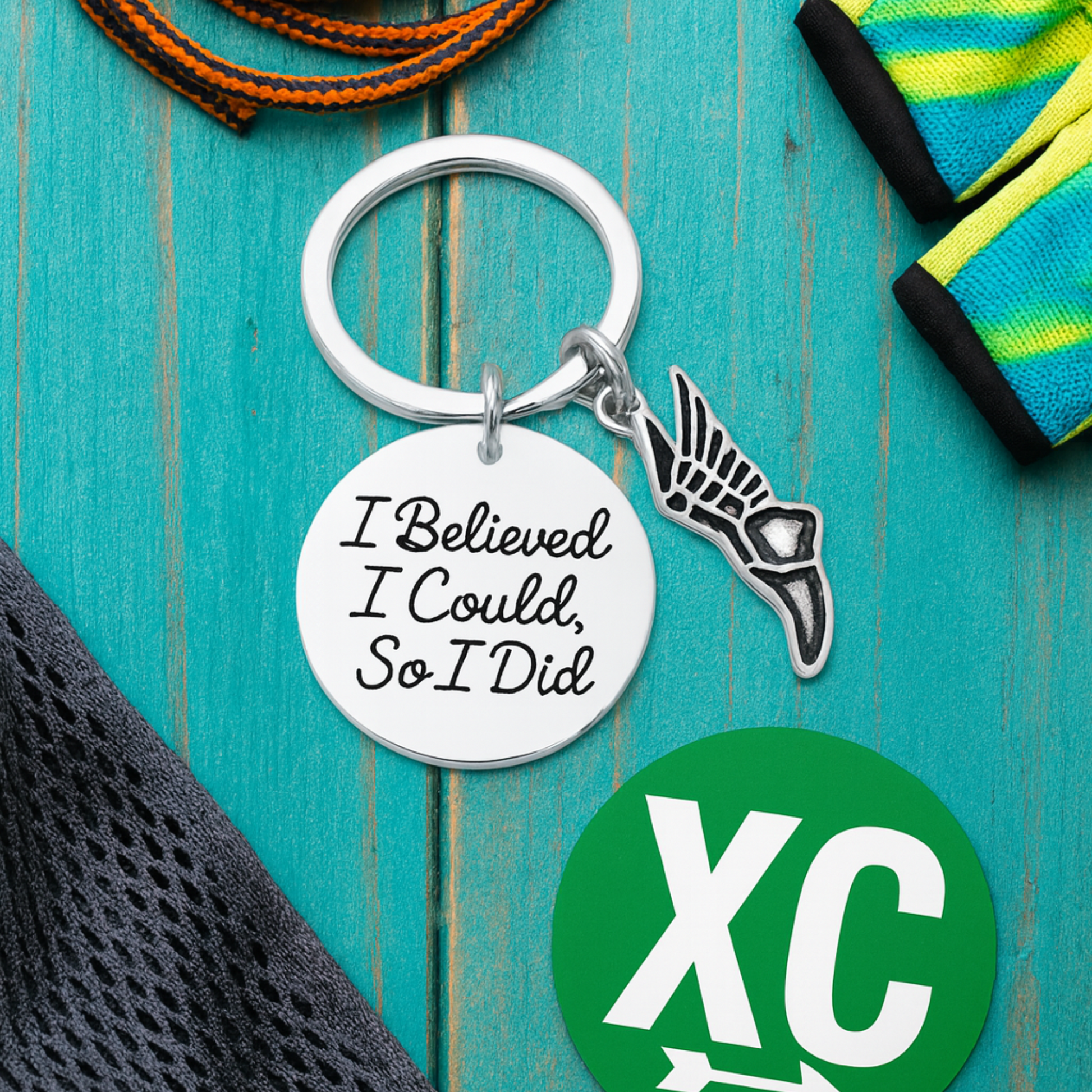 Inspirational running keychain with silver shoe charm and 'I Believed I Could So I Did' disc on cross country card