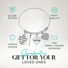  Gift-ready twirling bracelet with motivational charm sayings, shown with icons for hypoallergenic and quality design
