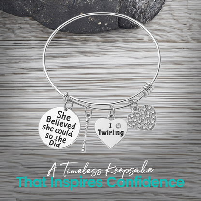 Silver twirling bangle bracelet photographed on wood background with message "I twirl therefore I sparkle"