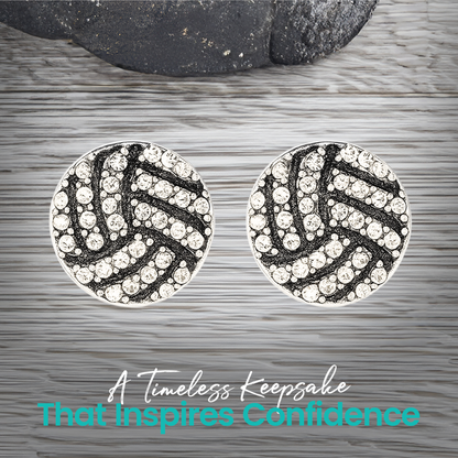 Pair of rhinestone volleyball earrings shown on gray wood surface, trendy everyday sports accessory for athletes