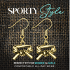Close-up of silver martial arts earrings in packaging labeled “Gift for Your Loved Ones”