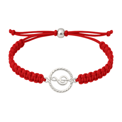 Red rope bracelet with silver treble clef charm, adjustable slip knot closure.