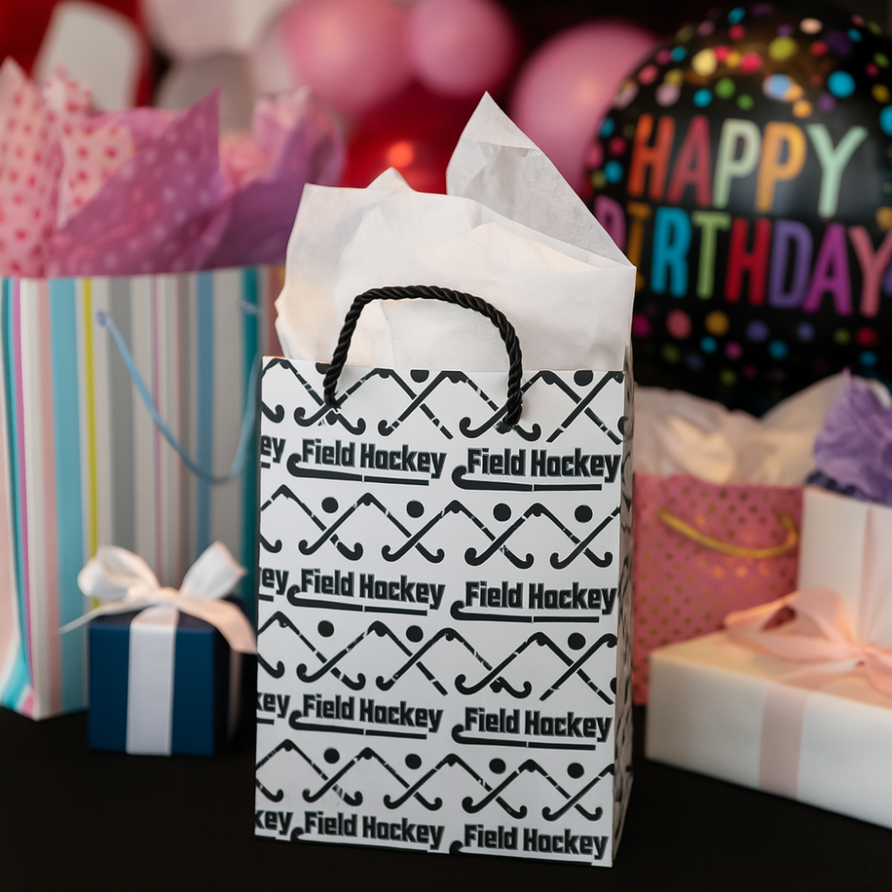 Field hockey gift bag with stylish design and tissue paper, perfect for special occasions and giveaways.