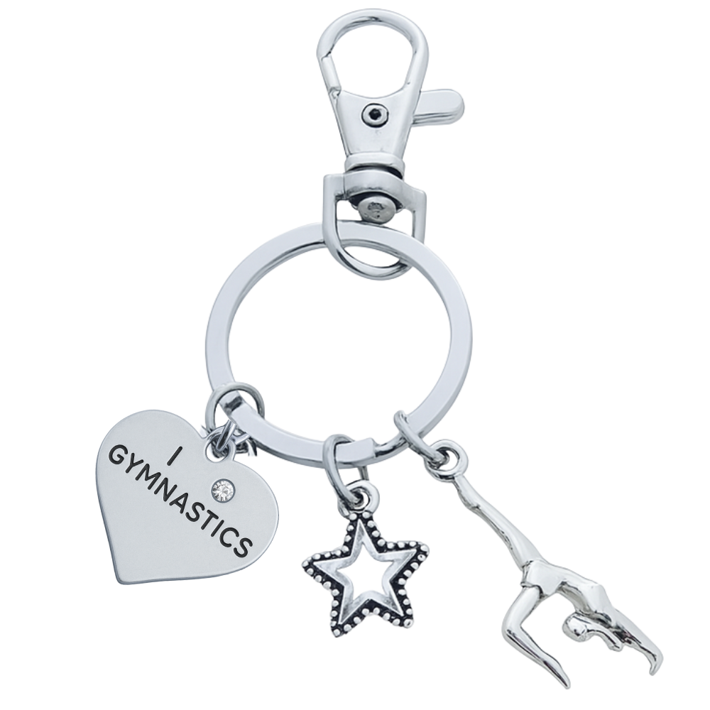 Gymnastics keychain with silver heart charm, star charm, and gymnast figure charm on a lobster clasp key ring.