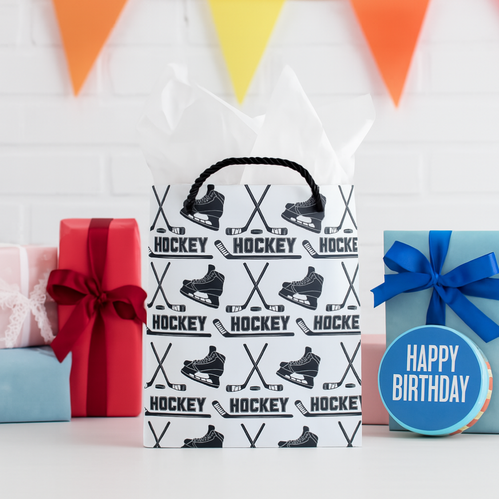 Ice hockey gift bag with hockey skate and stick designs, perfect for birthday gifts and celebrations.