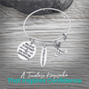 Field hockey inspirational charm bracelet with text highlighting unique design and perfect gift idea