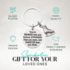 Inspirational figure skating keychain with engraved quote and skate charm displayed on neutral background