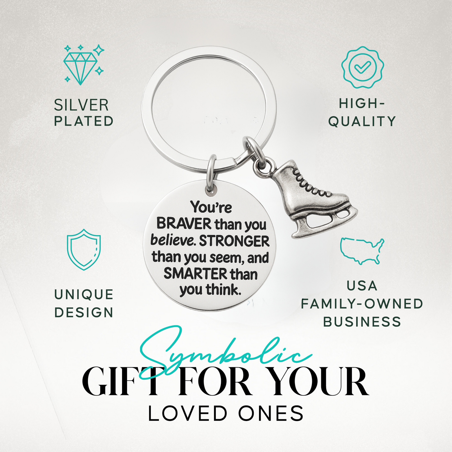 Inspirational figure skating keychain with engraved quote and skate charm displayed on neutral background
