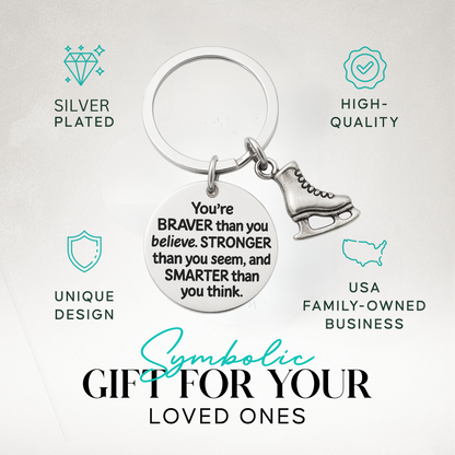 Inspirational figure skating keychain with engraved quote and skate charm displayed on neutral background