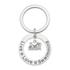 Silver swim keychain with circular charm engraved with 'Live Love Swimming' and dangling 'I Love to Swim' charm in center – swimmer gift accessory