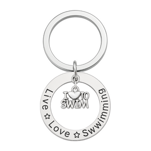 Silver swim keychain with circular charm engraved with 'Live Love Swimming' and dangling 'I Love to Swim' charm in center – swimmer gift accessory