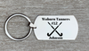 Engraved stainless steel field hockey dog tag keychain attached to silver keyring