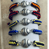 Colorful braided softball bracelets with silver charms, perfect softball jewelry and gifts for girls and teams.