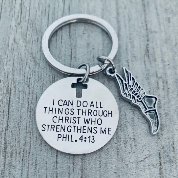 Inspirational running keychain with cross cutout, engraved scripture, and track wing charm for athletes