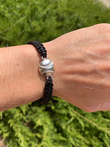 Black softball rope bracelet worn on wrist with silver baseball charm, ideal for girls softball gifts and team spirit.
