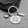 Basketball coach keychain with Thank You charm and engraved quote displayed on rustic wood