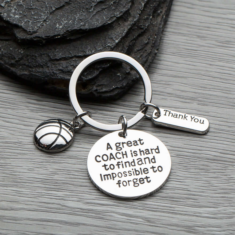 Basketball coach keychain with Thank You charm and engraved quote displayed on rustic wood