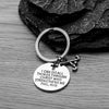 Christian field hockey keychain displayed on branding card with cross and scripture design, ideal gift for players and coaches