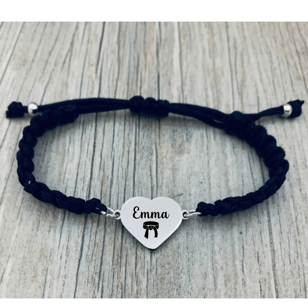 Graphic with black background displaying waterproof stainless steel martial arts bracelet with rust-proof text