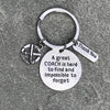 Silver coach appreciation keychain displayed on fabric with engraved quote and field hockey stick charm