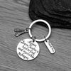 Silver-tone keychain with Irish dance shoe charms and engraved quote, shown on black background