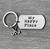 My Happy Place keychain shown on gray background with tag and field hockey charm