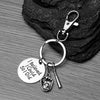 Softball bat and glove keychain displayed on black background with stainless steel components