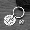 Close-up of keychain with “Do What You Love, Love What You Do” motivational quote
